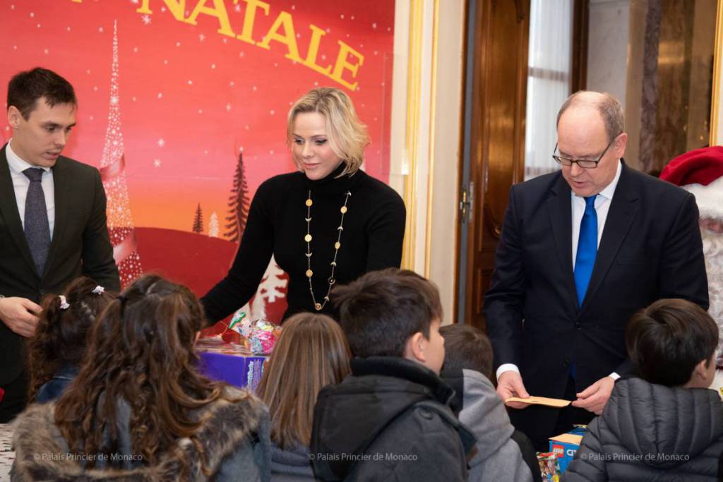 Prince Albert and Princess Charlene give out Red Cross Christmas Gifts