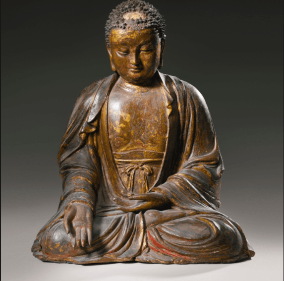 cast iron sculpture of an apprentice of Buddha