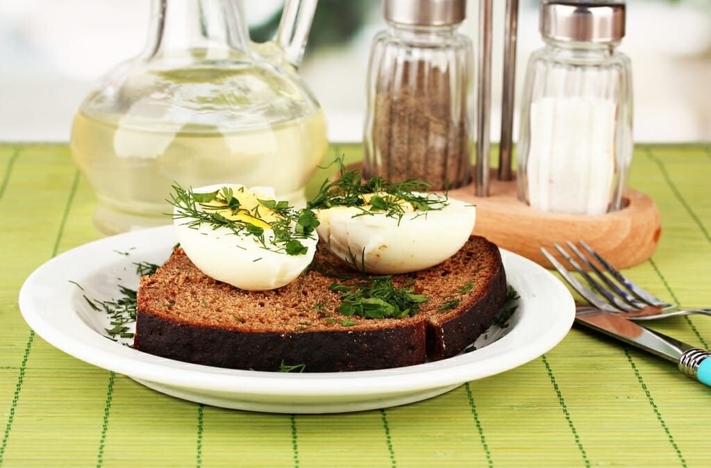 Boiled eggs on dark bread