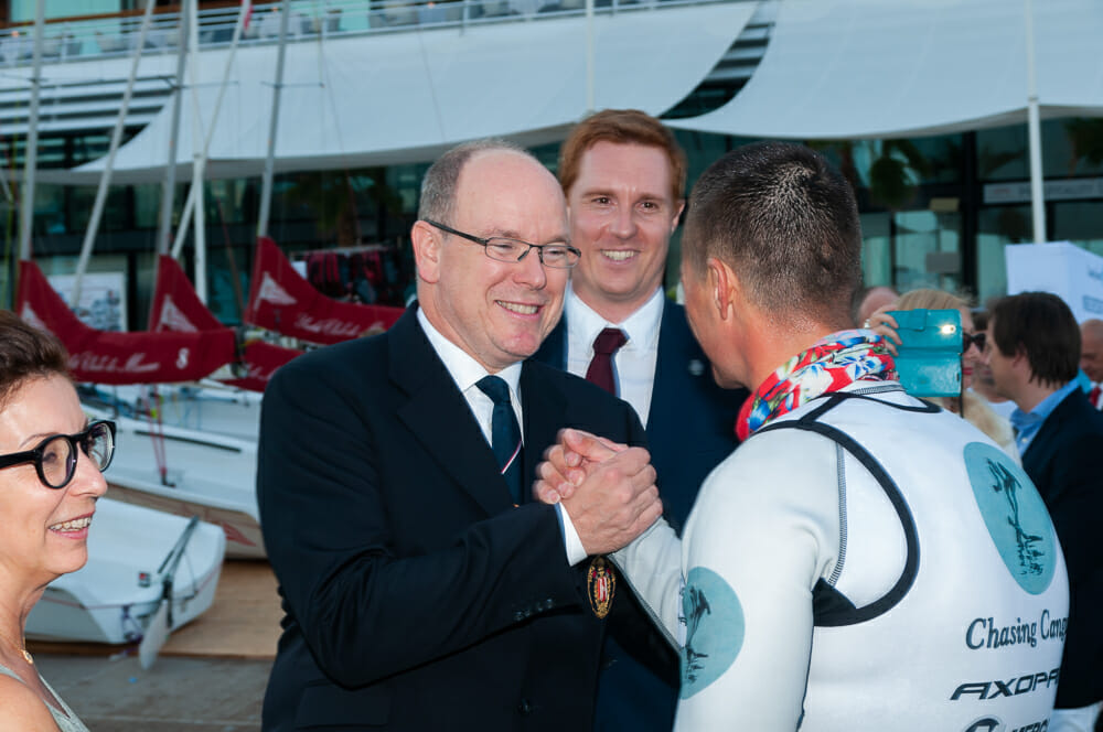 Prince Albert II greets marathon water skier Alex Luther