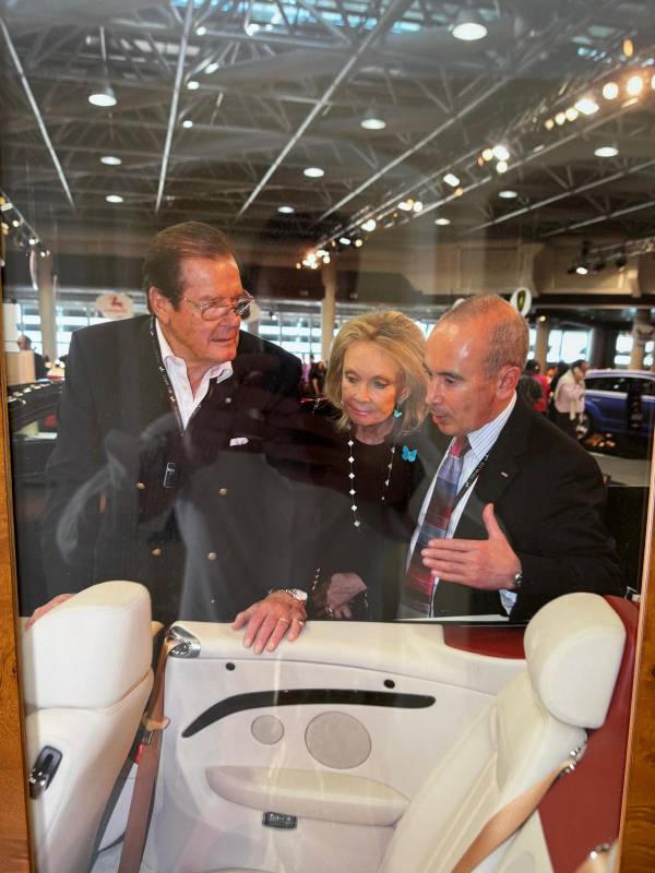Lawrie Lewis with Sir Roger Moore and his wife